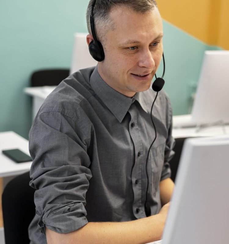 man-working-call-center-with-headphones-computer